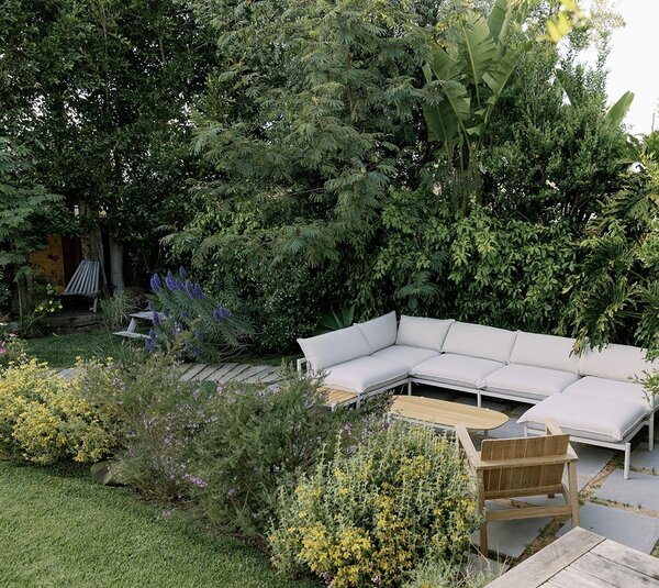 A healthy budget for landscaping allowed Leah to achieve a natural, wild look with plants. “I wanted to look out and see just lush plants growing wild,” she says. The collage of native vegetation was also used to soften the transitions between surface materials and backyard zones.