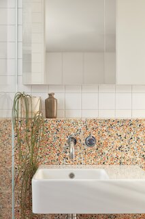 Classic Ceramics wall tiles are combined with Caroma Cube ceramic basins in the bathrooms.