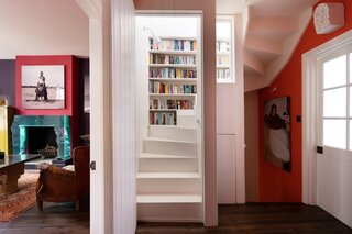 Heritage architecture can be found all throughout the abode, including the built-in bookshelves winding up the main staircase.
