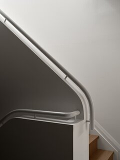 ODAMI designed a new railing that picks up a language of curves found throughout the house.