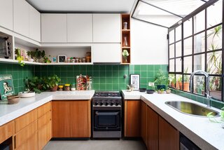 The green backsplash tiles are vintage, reclaimed from another project. 