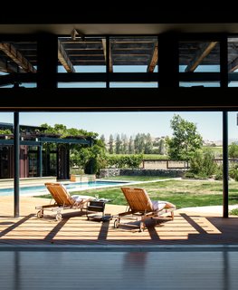 Twenty-foot-wide doors from Solar Innovations offer easy access to the deck. “Solar Innovations was the only manufacturer at that time that had a pocket multi-slider with a good ADA threshold,” says architect Erick Mikiten. “They almost look like steel, but are thermally broken aluminum.”