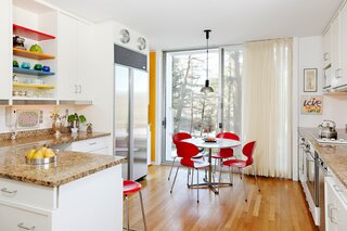 While updated, the kitchen maintains its connection to its mid-century roots through pops of color used against a mostly neutral background. 